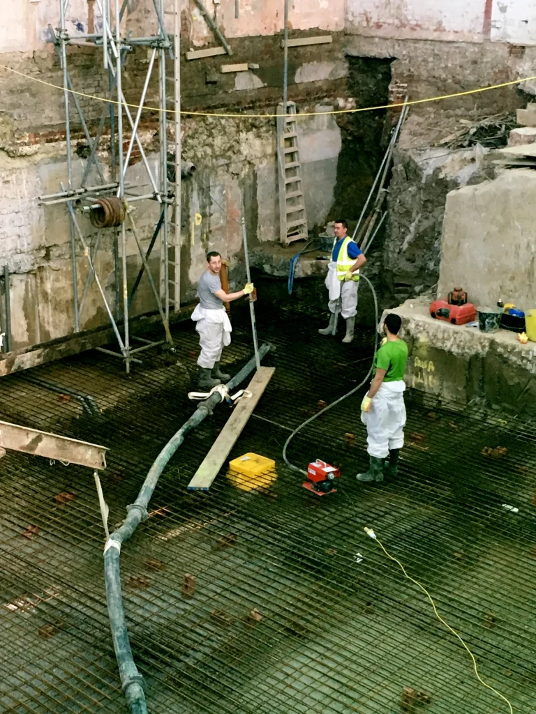 basement specialist London spraying waterproofing to rebar